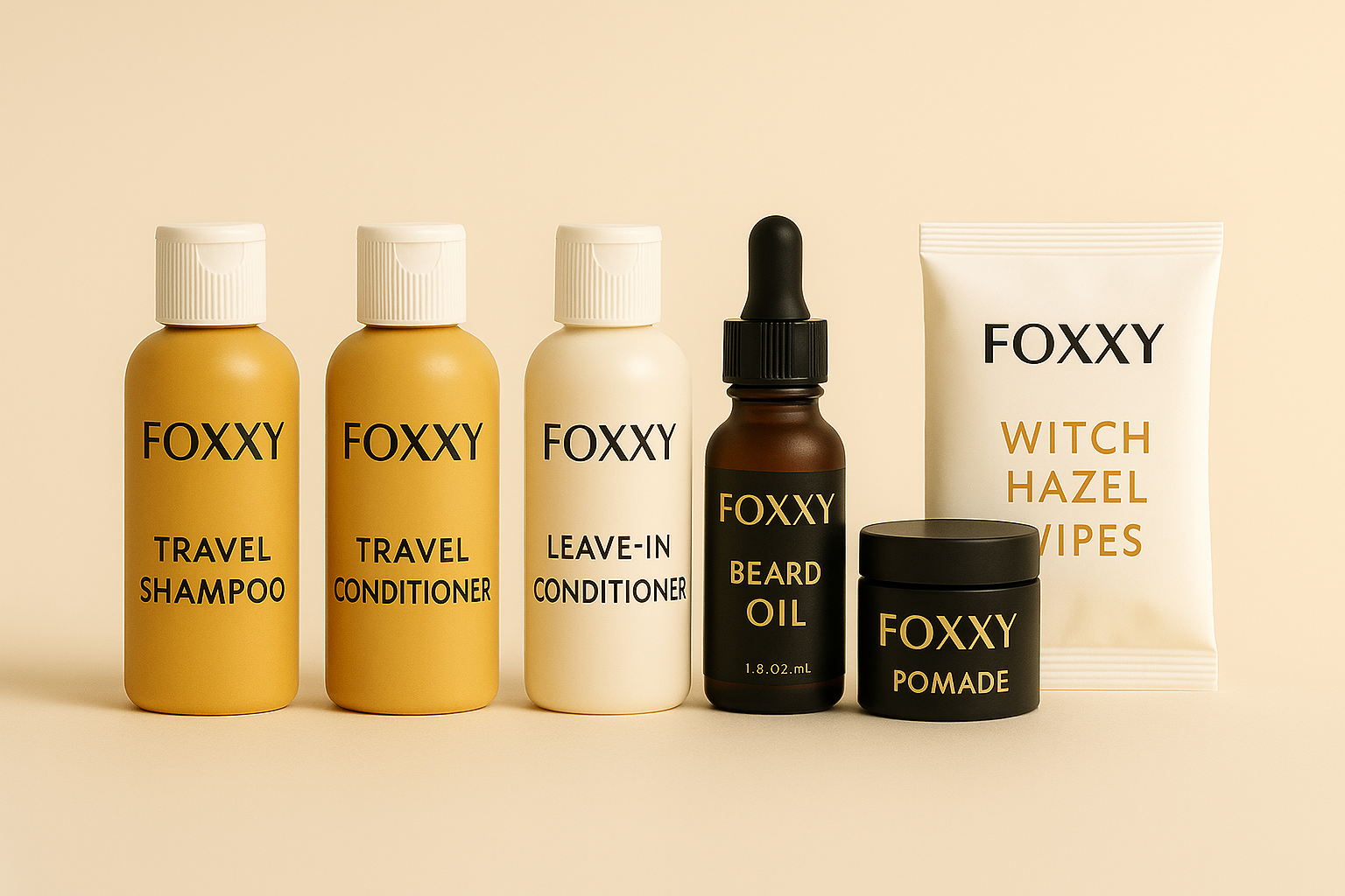 Lineup of FOXXY travel-size personal care products including shampoo, conditioner, leave-in conditioner, beard oil, pomade, and witch hazel wipes, displayed against a beige background.